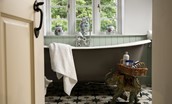 Rowchester West Lodge - feature claw foot bath tub in the first floor bathroom
