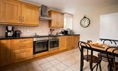East End Cottage - the kitchen has a warm cottage feel with additional space for informal dining