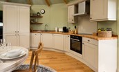 The Treehouse - the curved Shaker-style kitchen is well-equipped