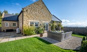 Bracken Lodge - large fully enclosed garden to the side of the property with patio area and gas barbecue