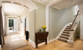 Cairnbank House - access into the light filled access hall with parquet flooring and central staircase