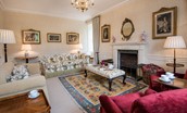 Edenside House - drawing room with ample seating and decorative fireplace