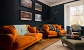 Cairnbank House - the sitting room with velvet sofas is the perfect spot for some relaxation time