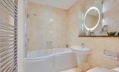 Skyfall - family bathroom with shower over P-shaped bath, heated towel rail, WC and basin