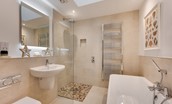 Samphire Barn - ground floor family bathroom with walk-in shower, double ended bath with shower attachment, WC and basin