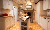 The Woodworker's Cottage - kitchen with feature woodburner and central island