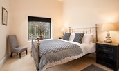 Tutor's Lodge - bedroom one features a vaulted ceiling making the room bright and airy