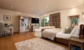 The Stables, Saltcoats Steading - bedroom one master bedroom with a super king size sleigh bed and TV with Sky Q