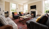 Seaview House - ample seating in the sitting room with cosy wood burner