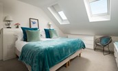 Duneside House - bedroom one with super king size bed and Velux windows