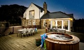 Hastings House - enjoy the large decking area with outdoor furniture and hot tub even after the sun sets