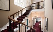 The Linen House - grand double-turn staircase leading to the second floor