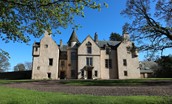 The Tower, Keith Marischal - the impressive front aspect of the house with the tower access and accommodation to the far left of this image