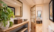 The Woodworker's Cottage - entrance hallway with wooden console table and access into dining area or sitting room