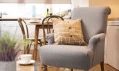 Swan's Nest - high-backed armchair with scatter cushion