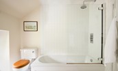 Crailing Coach House - bath with shower over in en suite bathroom