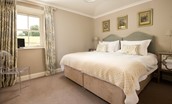 Crailing West Lodge - the bedroom with stylish and luxurious linens