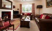 Kilham Cottage - comfortable seating, wood burner and TV in the sitting room