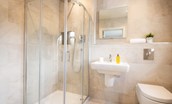 Bracken Lodge - en suite of bedroom two with corner walk-in shower with a rainfall shower head