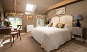 Brunton Granary - bedroom three with super king size bed, dressing table, TV, and built-in wardrobe