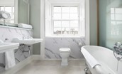 The Linen House - bedroom one's en suite benefits from double sinks and a freestanding slipper bath