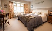 Greengate - bedroom one with king size bed, dressing table and side tables