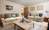 Partridge Lodge - the evening sitting room with comfortable seating for all of your party