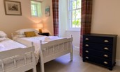 The White House - ground floor bedroom with twin beds and chest of drawers for storage