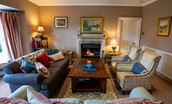 The Boathouse - the drawing room with open fire and ample seating