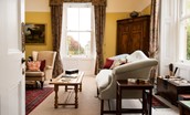The Old Manse - drawing room with sofa overlooks the front garden