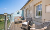 Skyfall - relax on the outdoor furniture situated on the balcony at the rear of the property