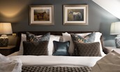 Coach House - bedroom three with blue tones and sumptuous bedding and cushions