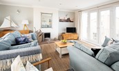 Farne View - open-plan living area with access onto small balcony from double patio doors