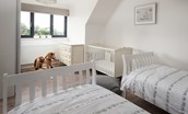Sunwick Cottage - bedroom three with fixed 3' twin beds and a separate full size cot