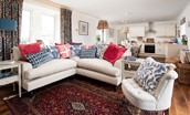 Brunton Lake - comfortable seating in the sitting room with corner sofa and armchair