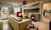 The Art House - the lounge area with an open fire at its heart