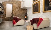 The Stables - modern log burning stove in the seating corner of the open plan kitchen