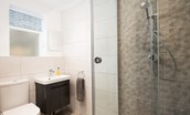 Peewit Cottage - family shower room with walk-in shower, heated towel rail, WC and basin