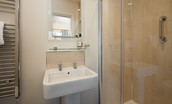 The Fairway - en-suite shower room with electric shower, WC, basin, and heated towel rail