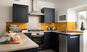 Peep-O-Sea Cottage - shaker-style kitchen with yellow tiles