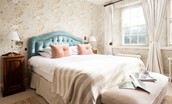 The Old Vicarage - bedroom three with double bed, bedside tables and ottoman storage bench