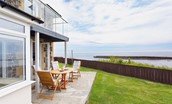 Sea Breeze - patio with lawned garden to the rear of the property with sea views
