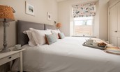 Cambridge House Cottage Number One - the bedroom with zip and links and view over garden