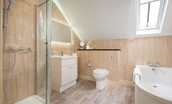 Dryburgh Steading One - bedroom two en-suite bathroom with shower and bath
