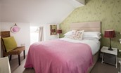 Nook End - bedroom two with double bed, chest of drawers, hanging rail and Velux window