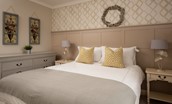 The Laurels - bedroom one with king size bed, chest of drawers and bedside tables