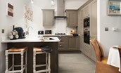 The Gallery - well-equipped kitchen containing 4-ring gas hob, oven, built in microwave, dishwasher, fridge/freezer and breakfast bar with two stools