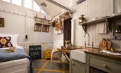 The Loovre - a shaker peg rail was custom made to maximise storage space in this tiny home