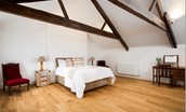 Number One Clayport Street - bedroom four on second floor with dressing table and exposed beams