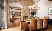 Coach House - open-plan living and dining areas share a double-sided wood burning stove
